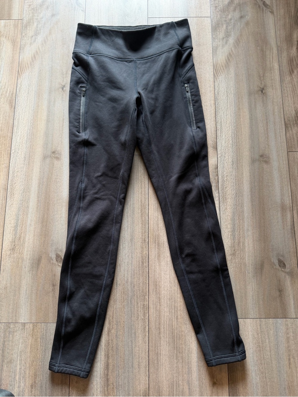 Athleta Black High-Rise Performance Leggings with Zip Pockets